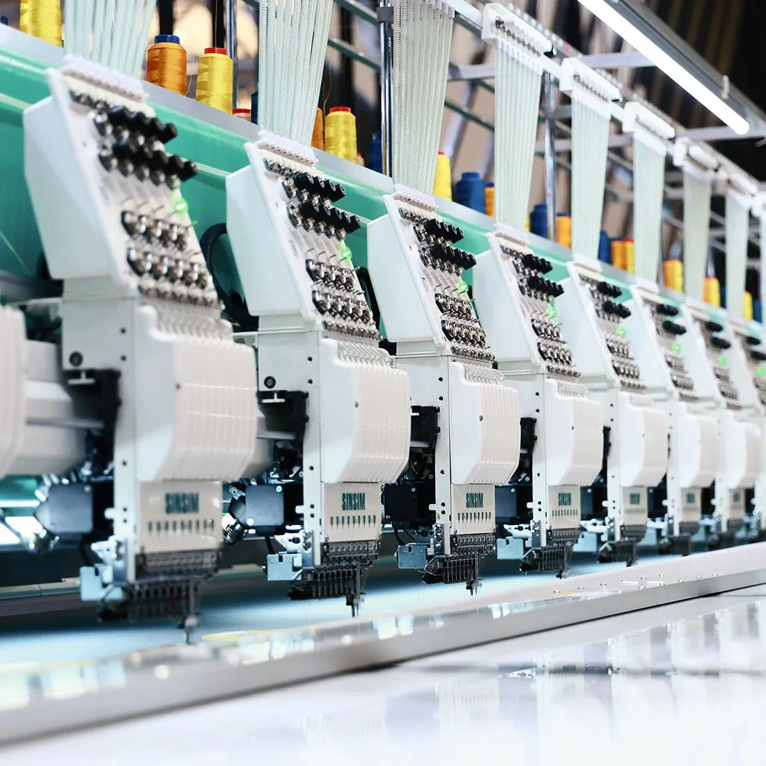 Sinsim multi-head embroidery machines on a production floor
